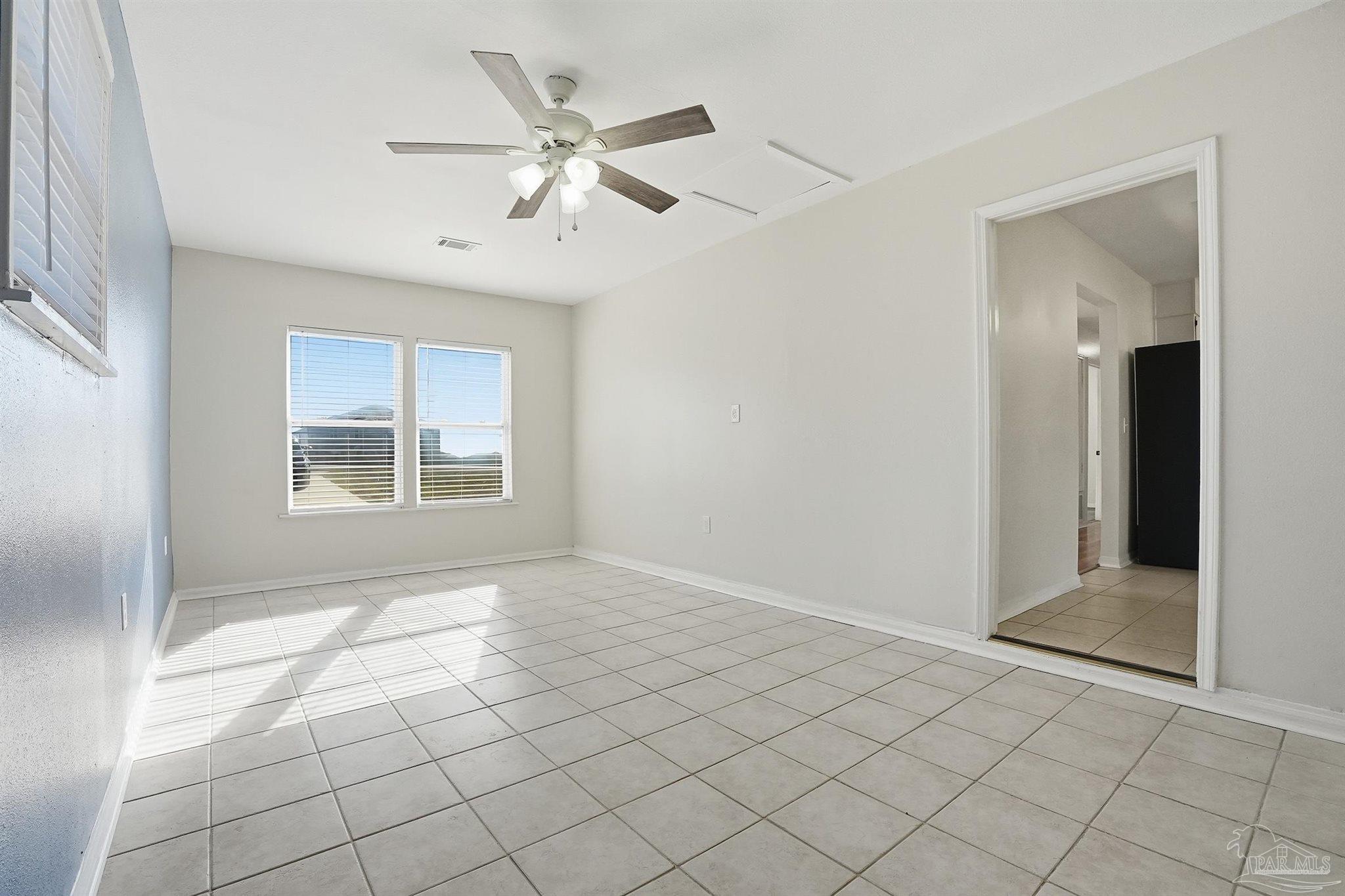 5590 Cyanamid Road Milton, FL 32583 - Photo 16 of 44 a view of an empty room with window and chandelier fan
