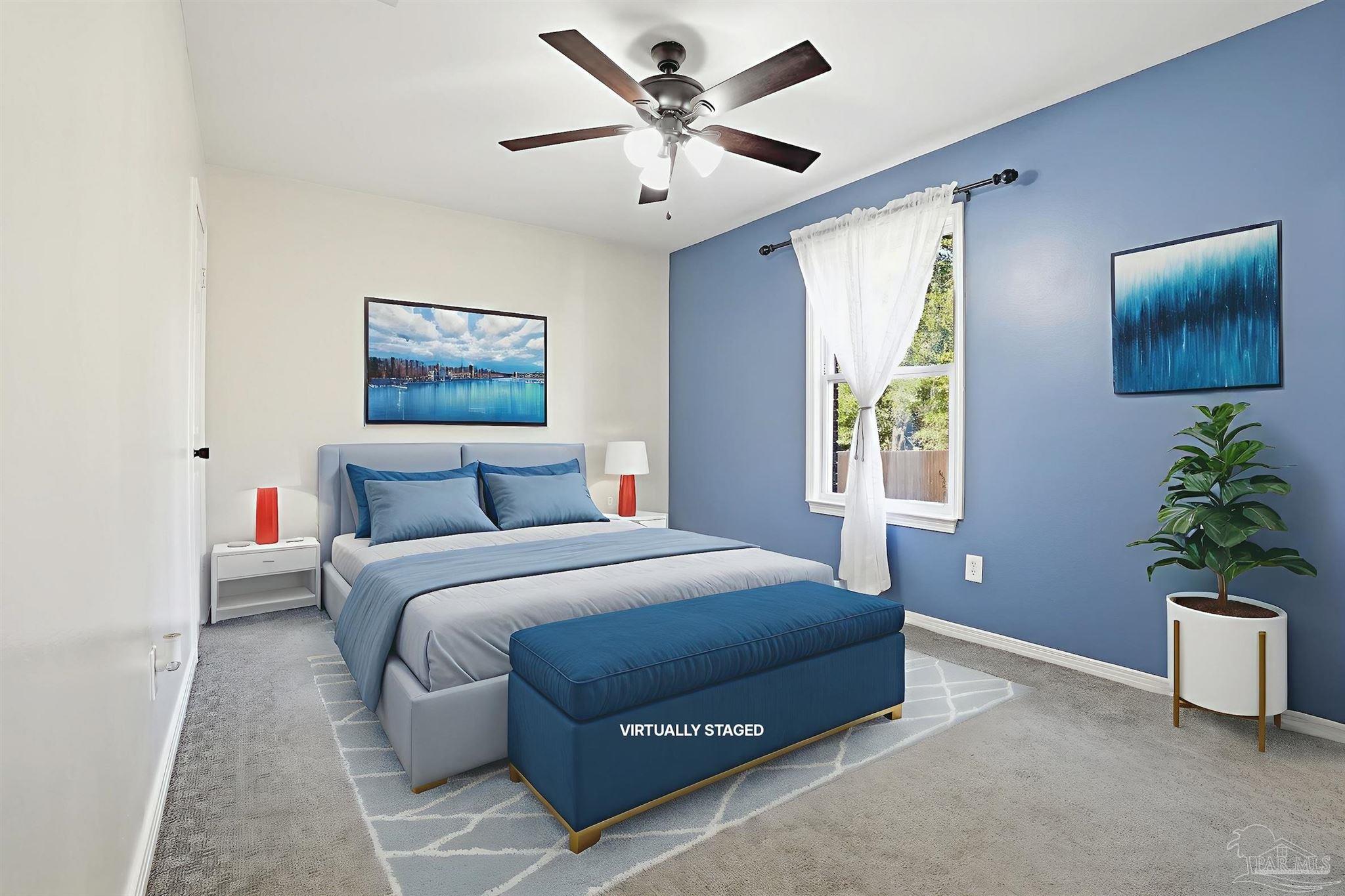 5590 Cyanamid Road Milton, FL 32583 - Photo 19 of 44 a spacious bedroom with a bed and a potted plant