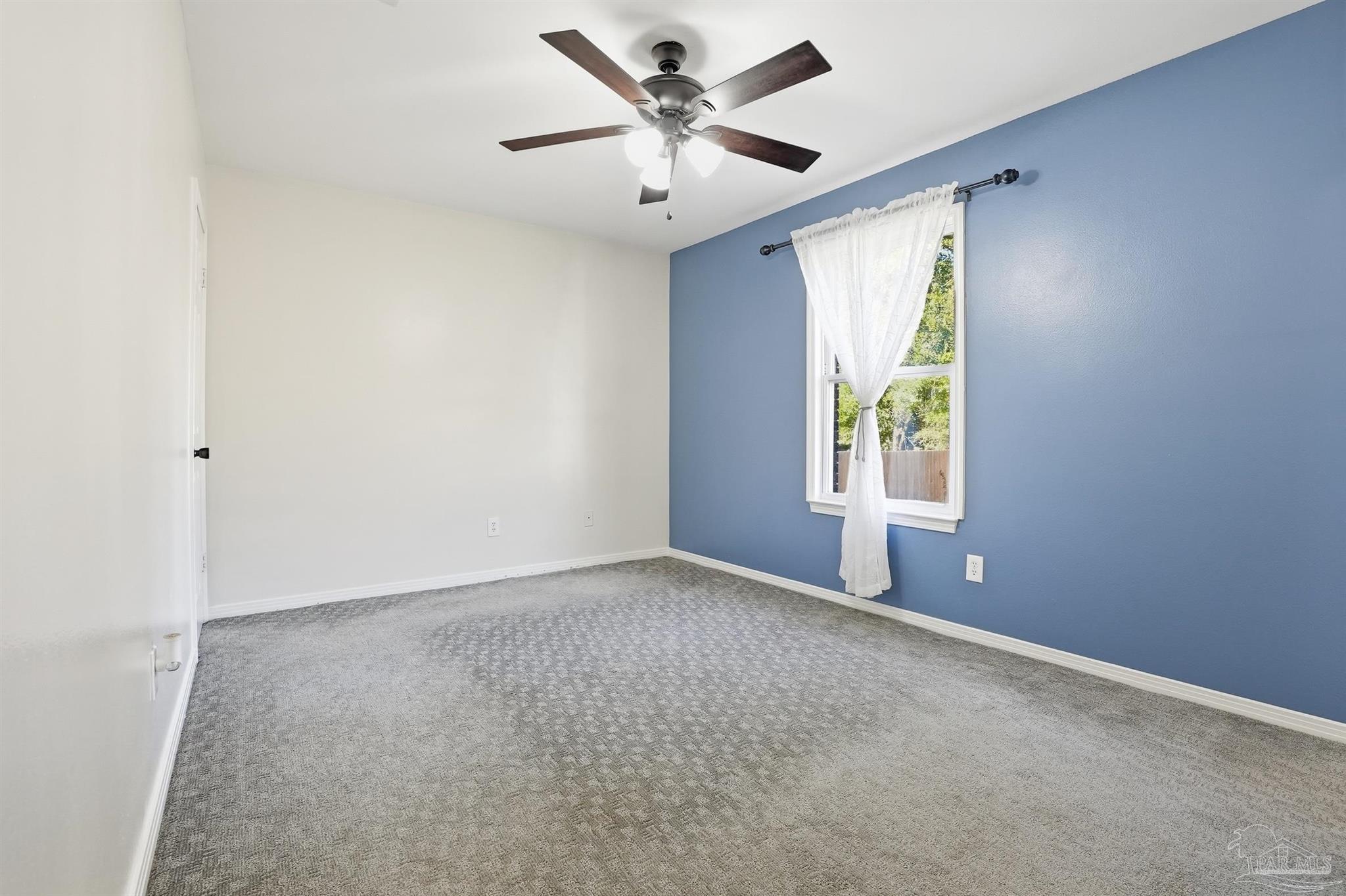 5590 Cyanamid Road Milton, FL 32583 - Photo 20 of 44 an empty room with windows and fan