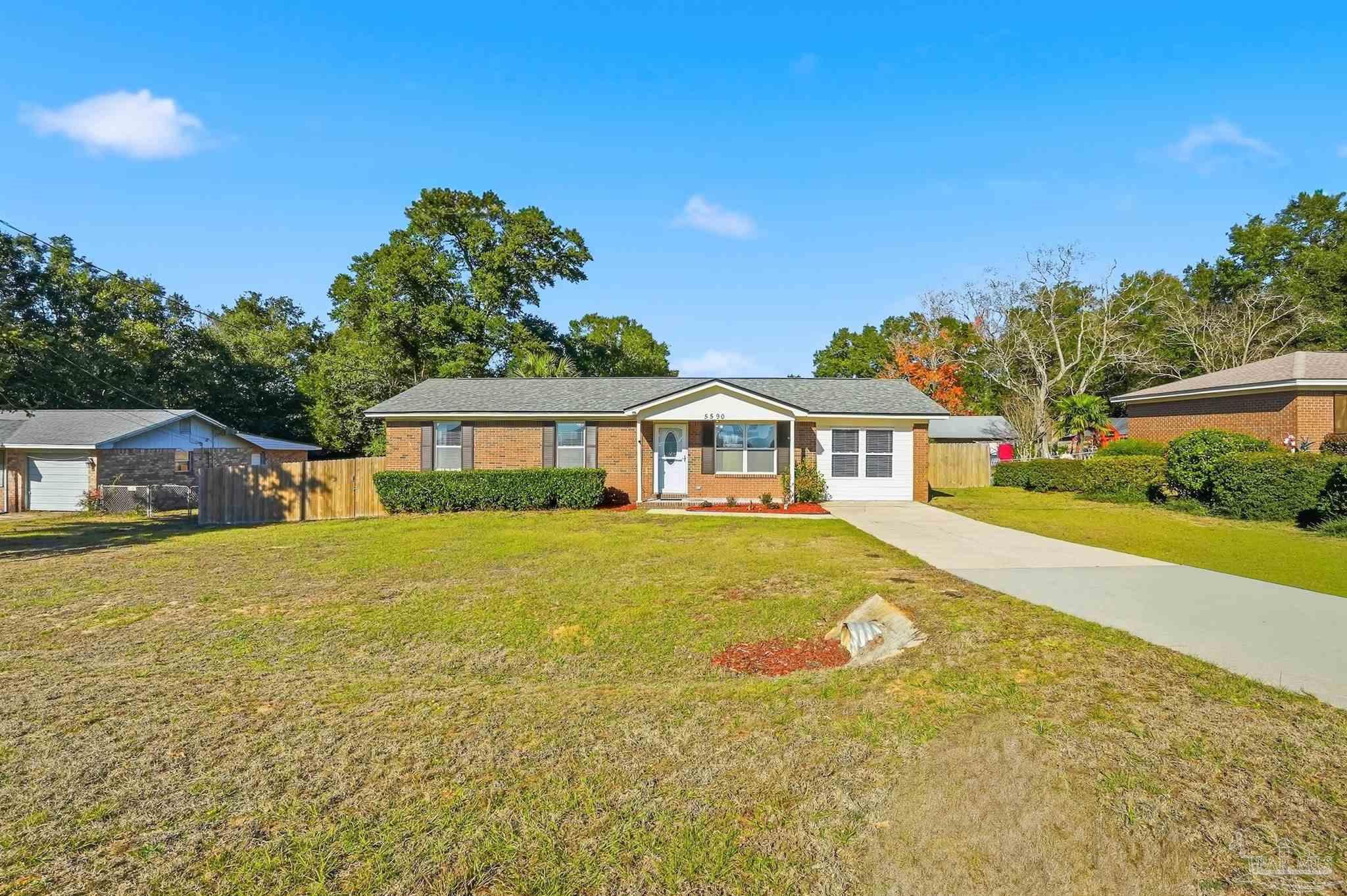 5590 Cyanamid Road Milton, FL 32583 - Photo 2 of 44 a front view of a house with a yard