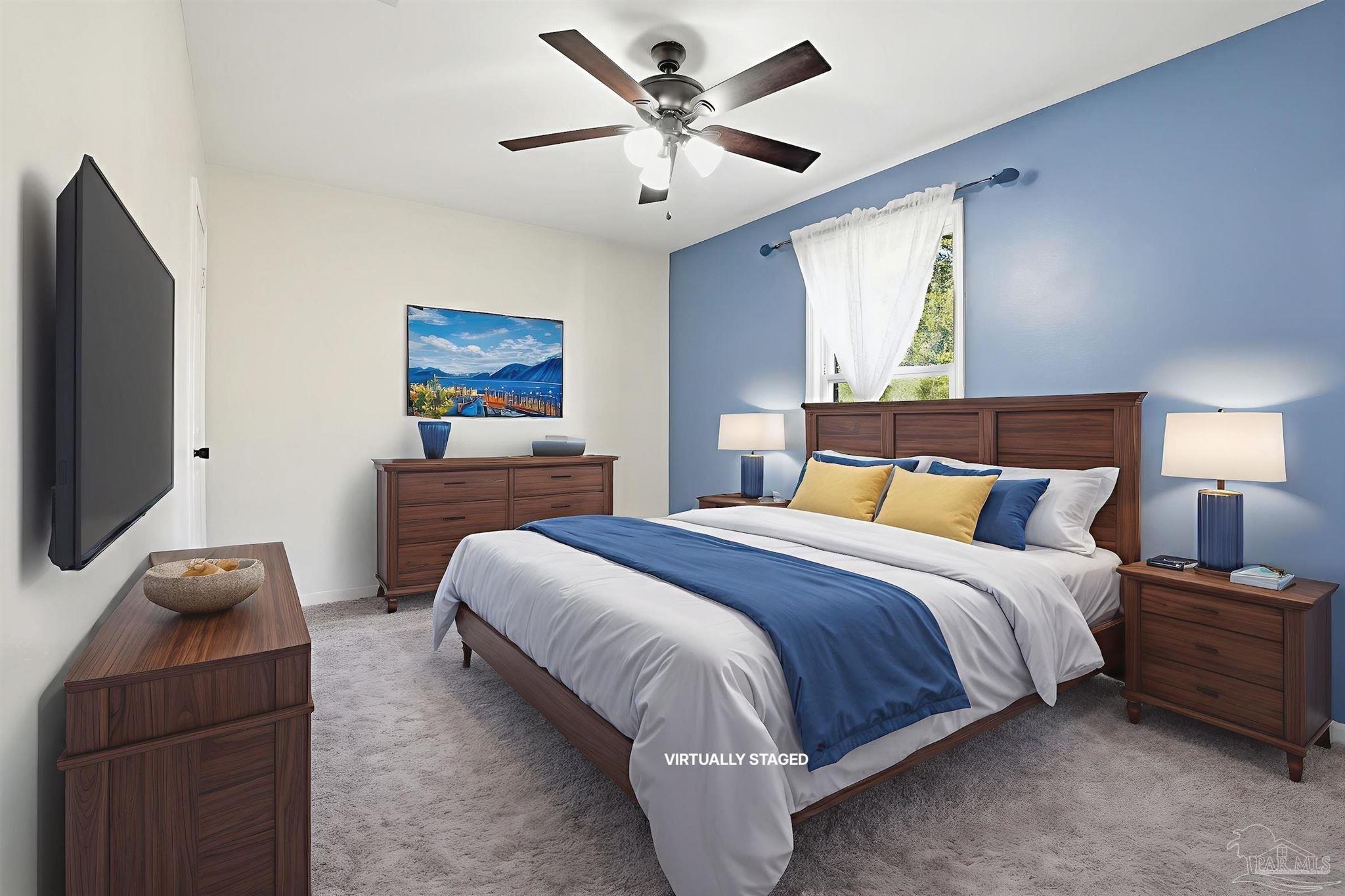 5590 Cyanamid Road Milton, FL 32583 - Photo 21 of 44 a bedroom with a bed and a flat screen tv