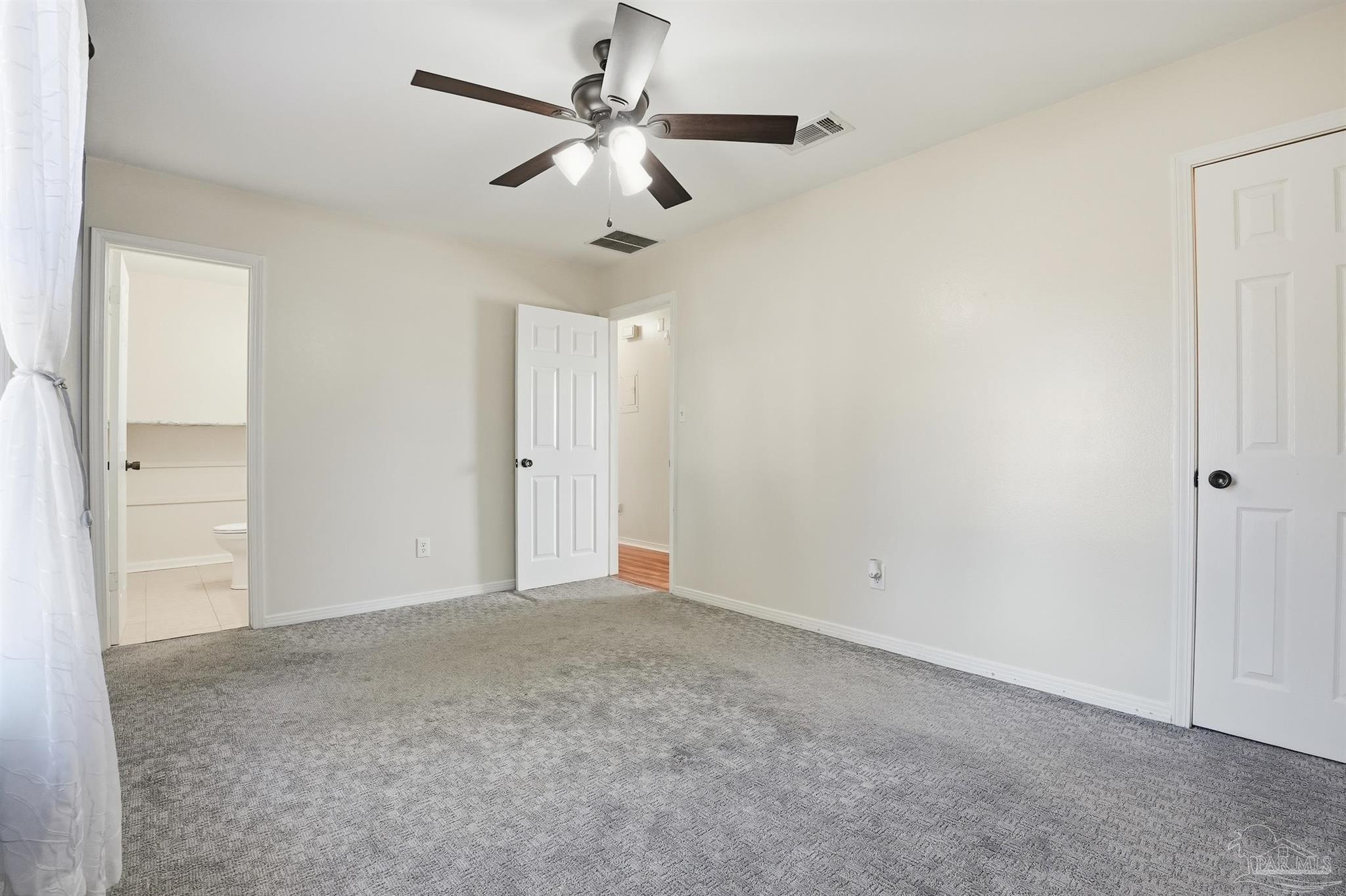 5590 Cyanamid Road Milton, FL 32583 - Photo 23 of 44 an empty room with a ceiling fan and a window