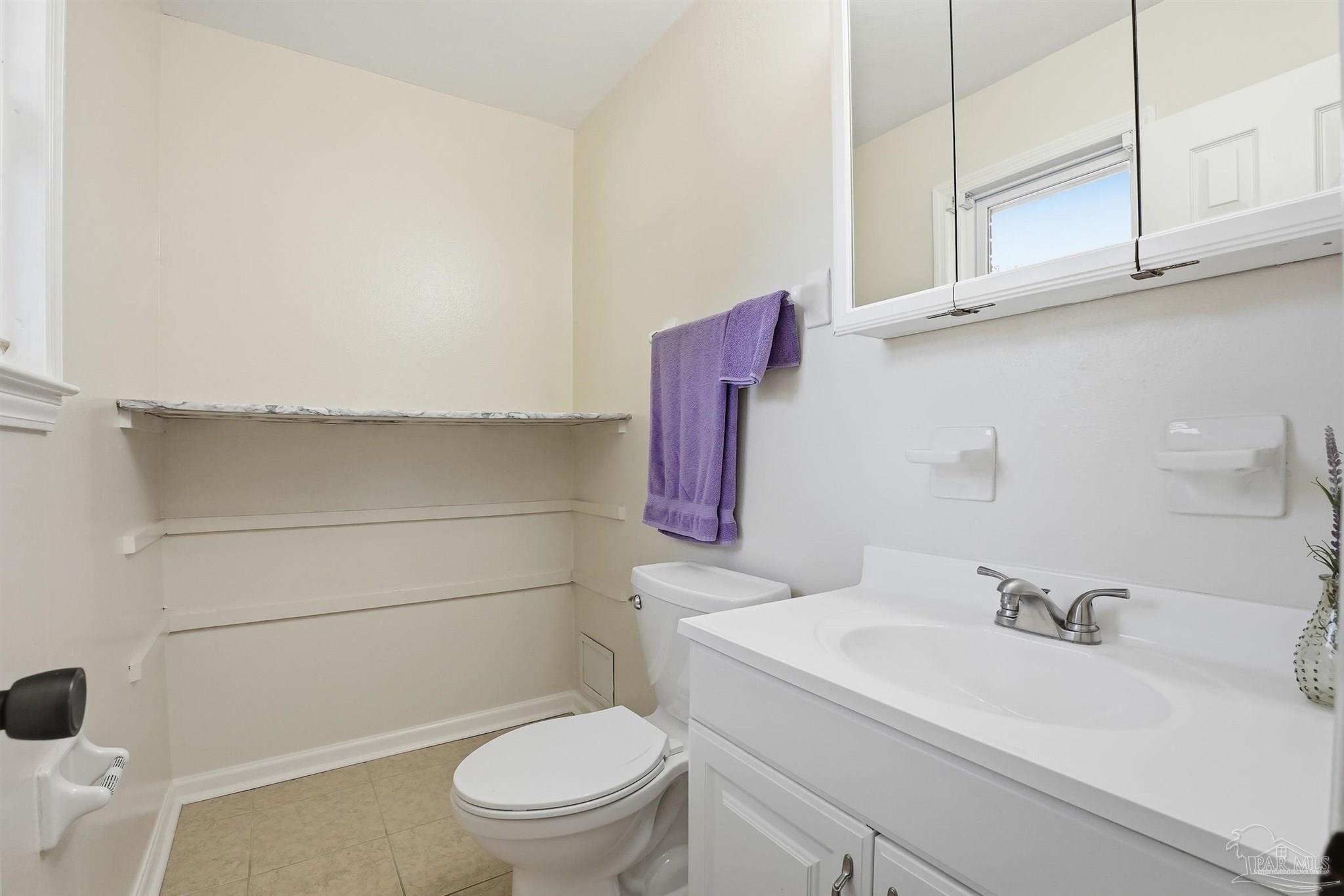 5590 Cyanamid Road Milton, FL 32583 - Photo 25 of 44 a bathroom with a sink a toilet and vanity
