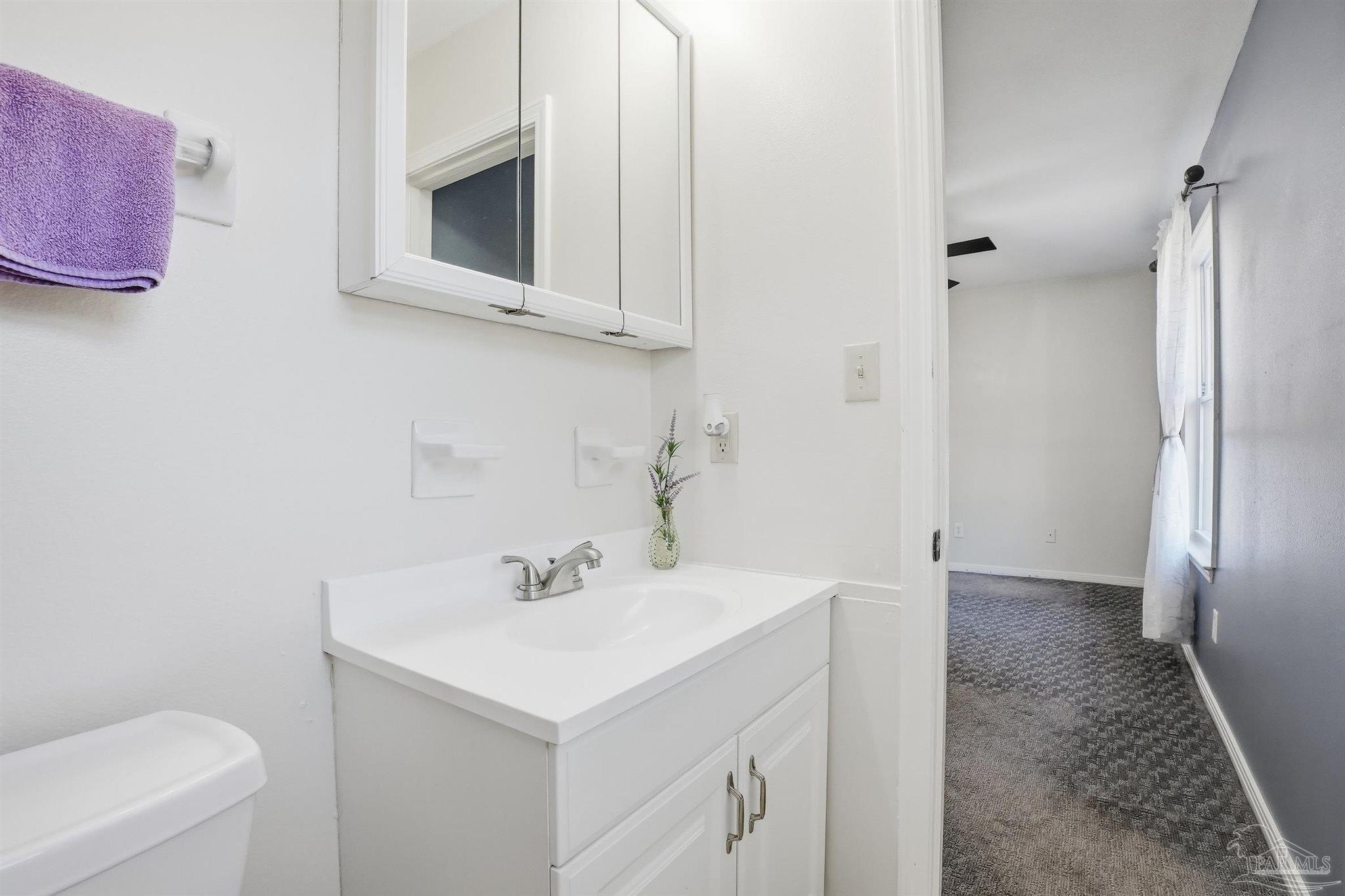 5590 Cyanamid Road Milton, FL 32583 - Photo 26 of 44 a bathroom with a sink a toilet and shower