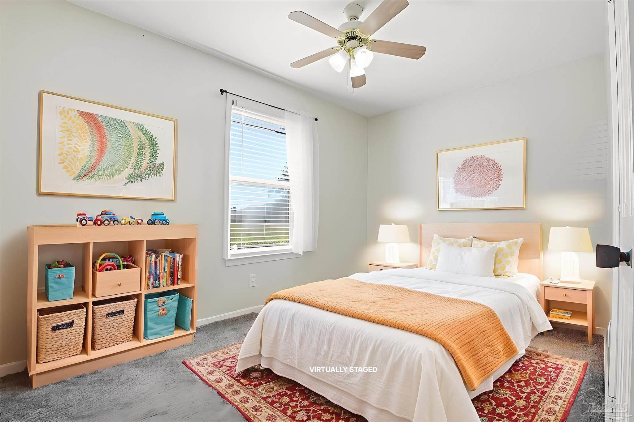 5590 Cyanamid Road Milton, FL 32583 - Photo 27 of 44 a bedroom with a bed painting on the wall and a window