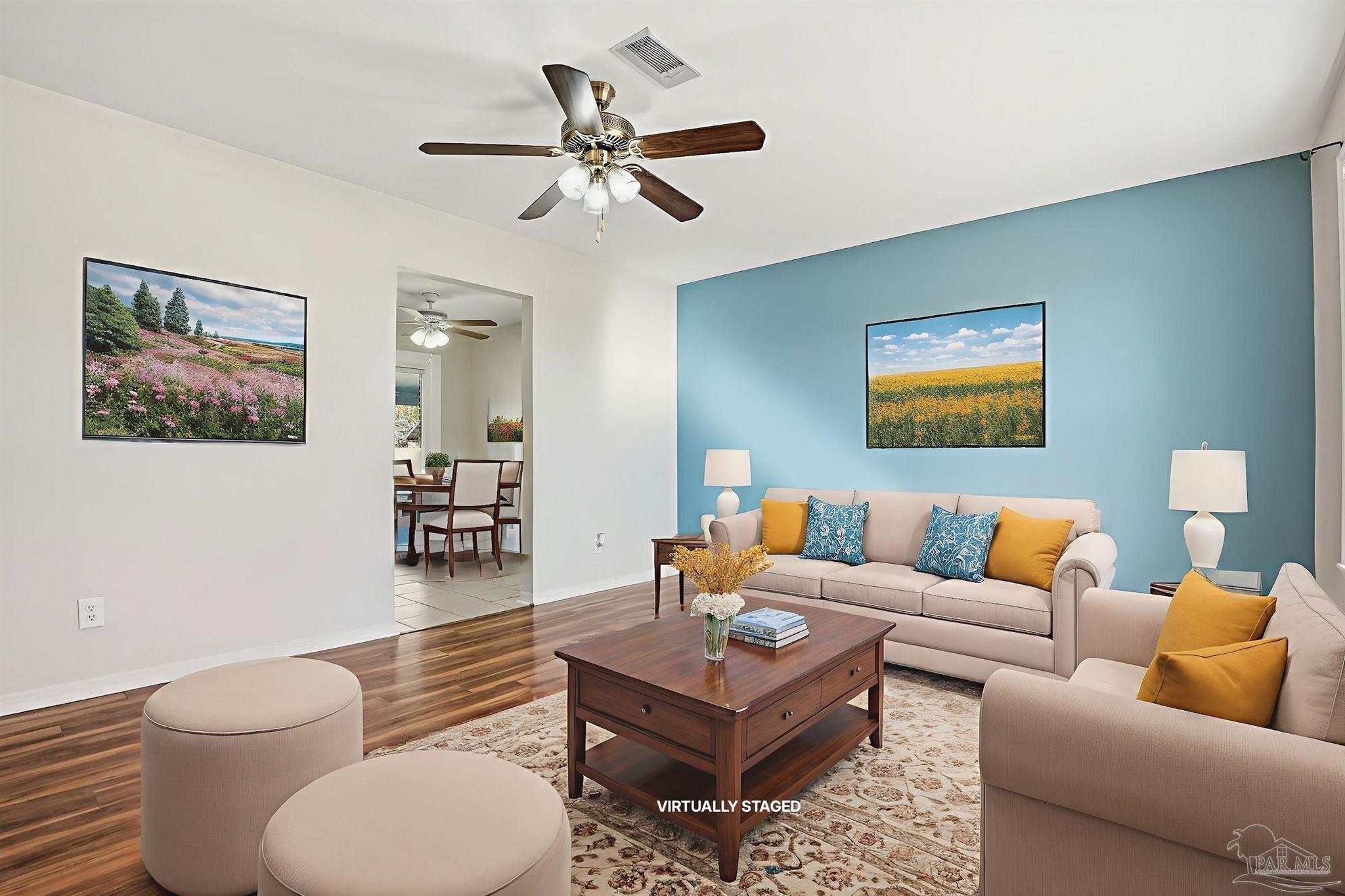 5590 Cyanamid Road Milton, FL 32583 - Photo 3 of 44 a living room with furniture a rug and a ceiling fan