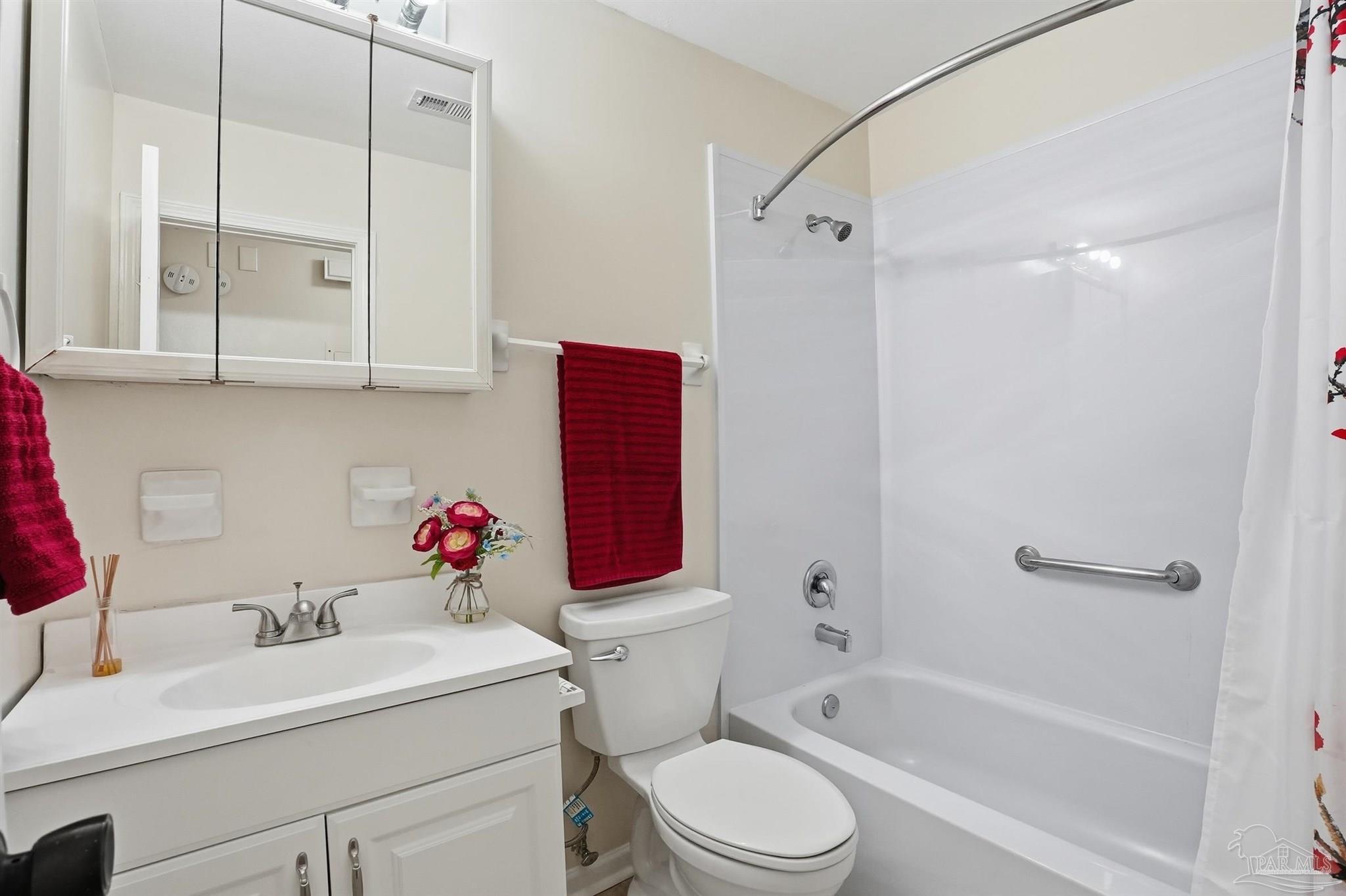 5590 Cyanamid Road Milton, FL 32583 - Photo 31 of 44 a bathroom with a sink toilet vanity and shower