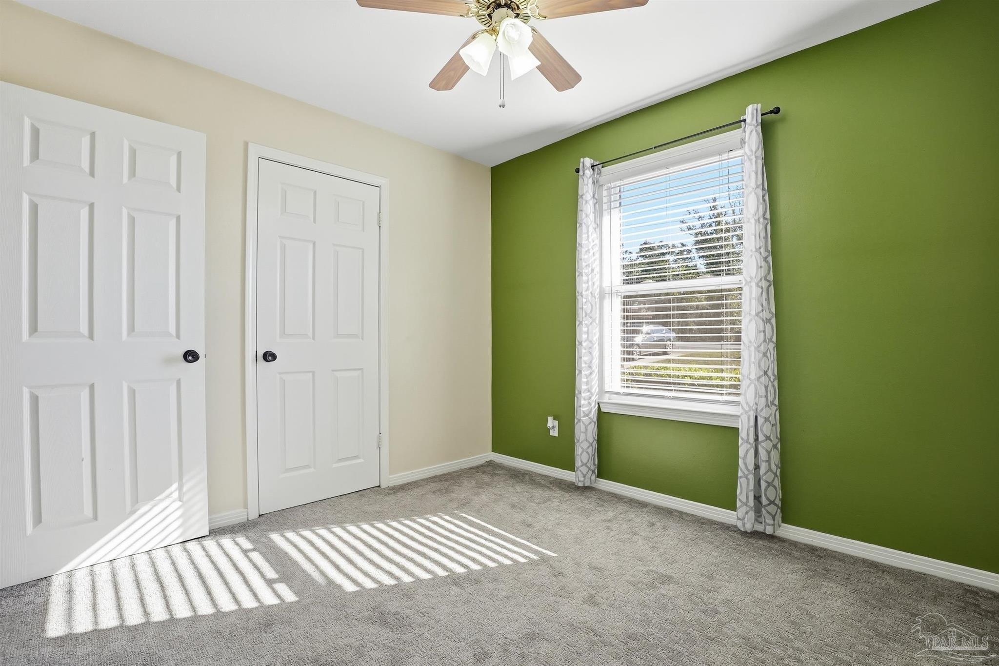 5590 Cyanamid Road Milton, FL 32583 - Photo 36 of 44 an empty room with a window and a chandelier