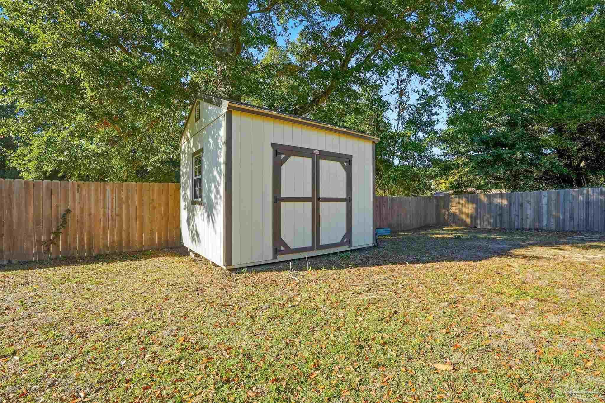 5590 Cyanamid Road Milton, FL 32583 - Photo 40 of 44 a view of backyard with tree