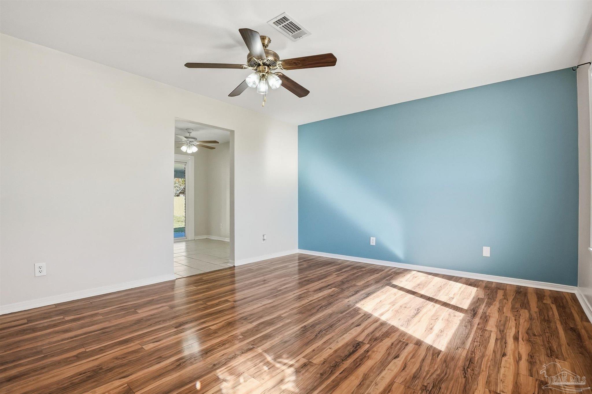 5590 Cyanamid Road Milton, FL 32583 - Photo 4 of 44 a view of empty room with wooden floor