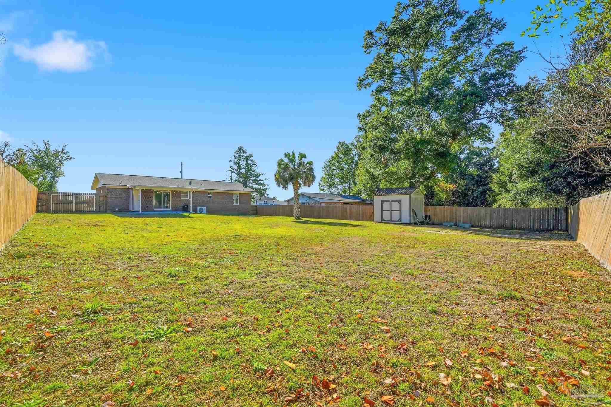 5590 Cyanamid Road Milton, FL 32583 - Photo 41 of 44 a swimming pool with outdoor seating and yard