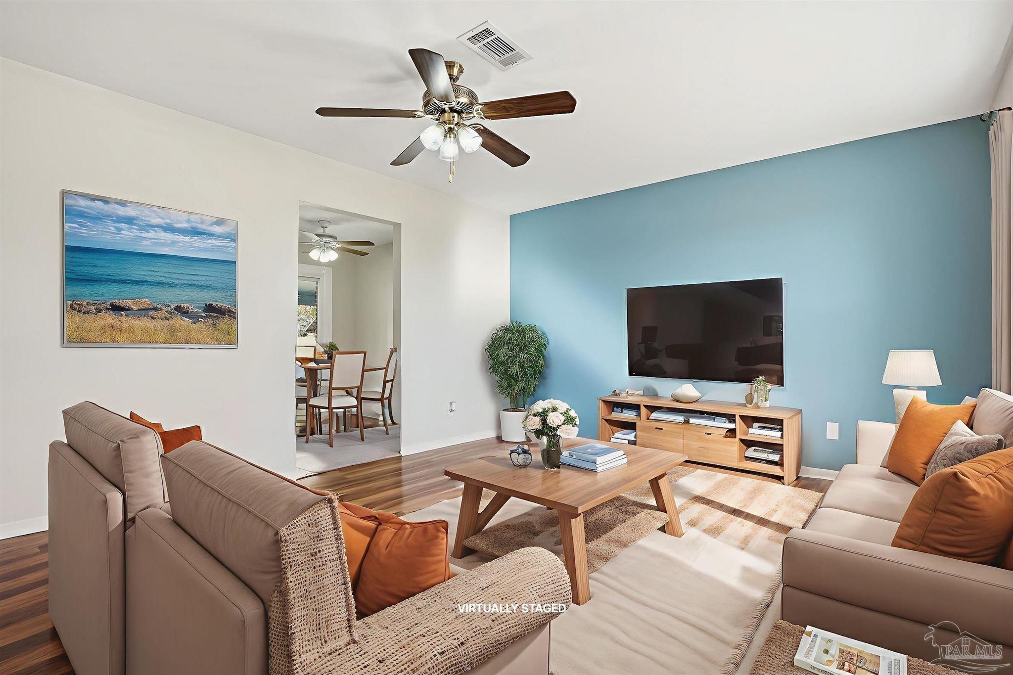 5590 Cyanamid Road Milton, FL 32583 - Photo 44 of 44 a living room with furniture and a flat screen tv