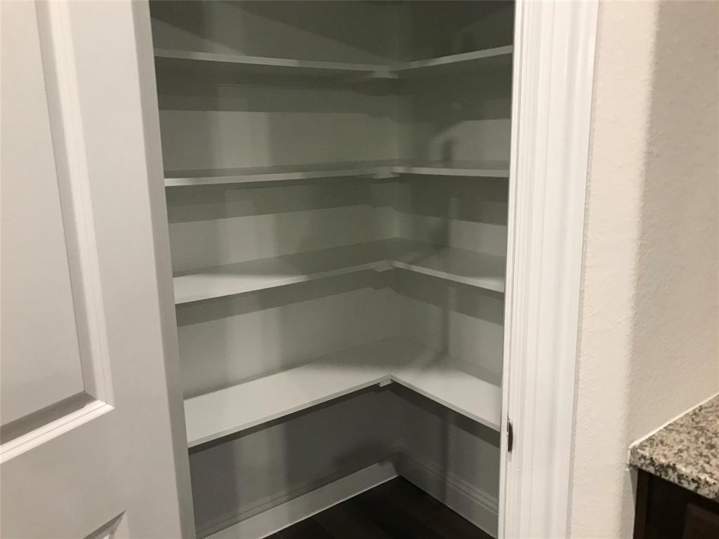 4111 Beamer Drive Forney, TX 75126 - Photo 12 of 25 a view of walk in closet with empty racks