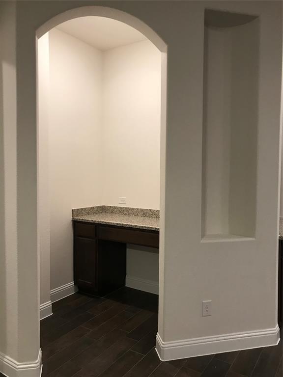 4111 Beamer Drive Forney, TX 75126 - Photo 18 of 25 a room with a bench and wooden floor