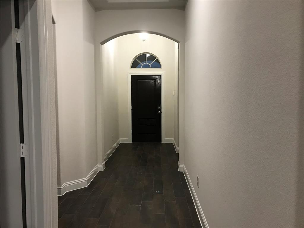 4111 Beamer Drive Forney, TX 75126 - Photo 9 of 25 a view of a livingroom from a hallway