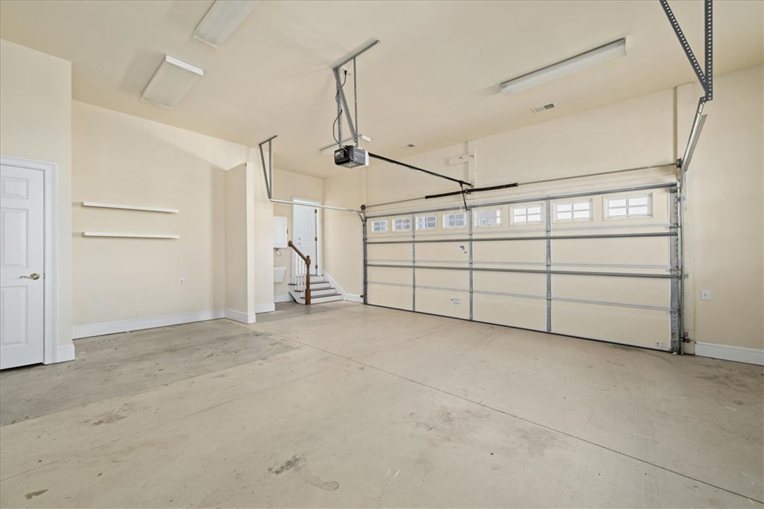 38 Angus Run Seneca, SC 29672 - Photo 27 of 46 This spacious garage offers ample room for parking and storage, featuring a functional overhead door.