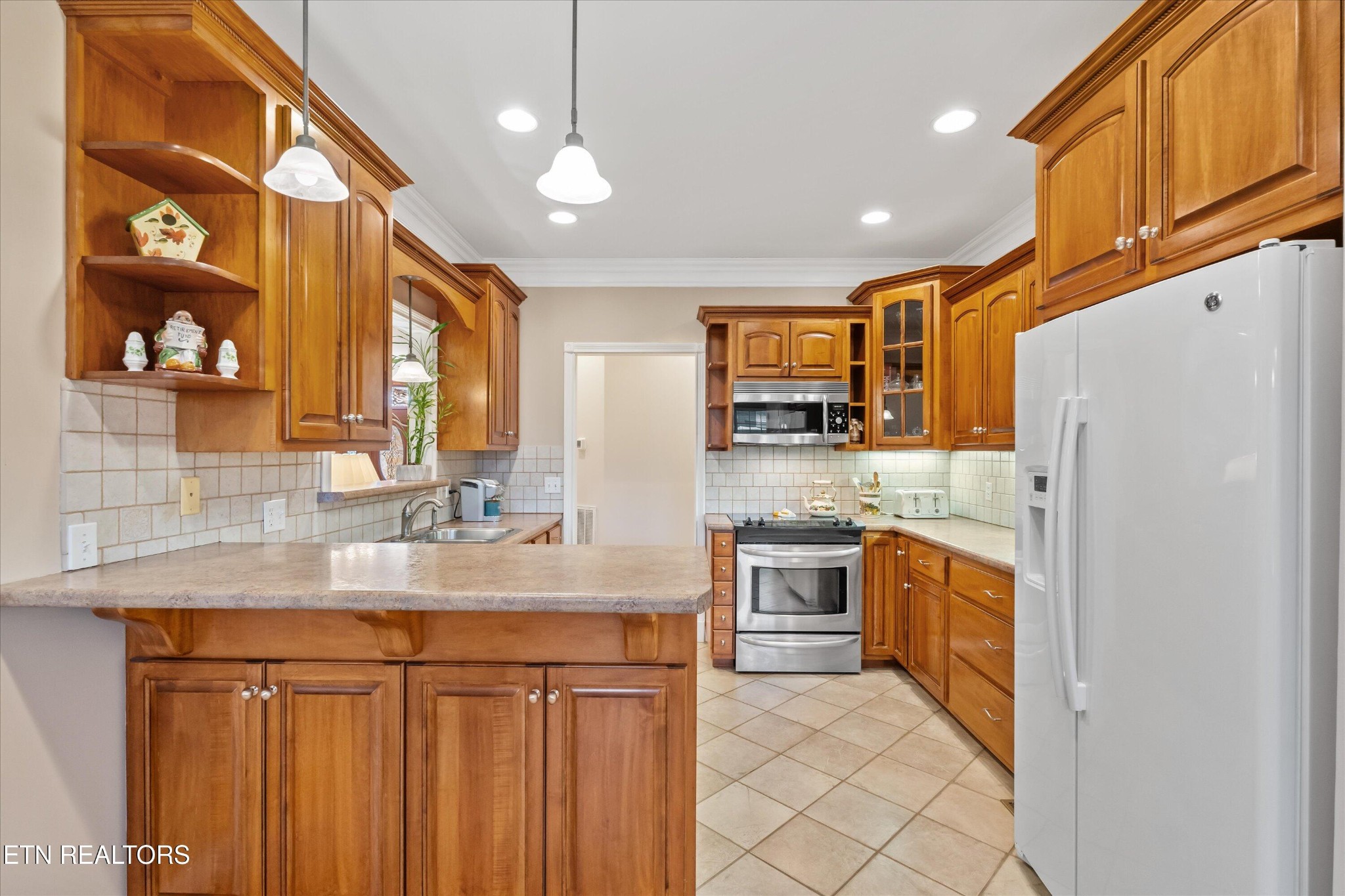 7613 Powderhorn Trail Townsend, TN 37882 - Photo 11 of 43 a kitchen with stainless steel appliances granite countertop a refrigerator and a sink