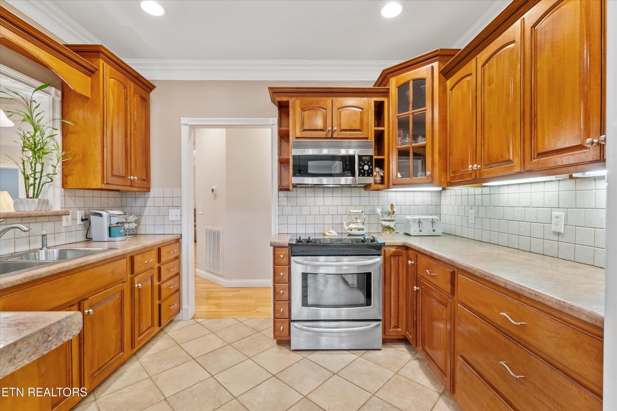 7613 Powderhorn Trail Townsend, TN 37882 - Photo 12 of 43 a kitchen with stainless steel appliances a stove sink and cabinets