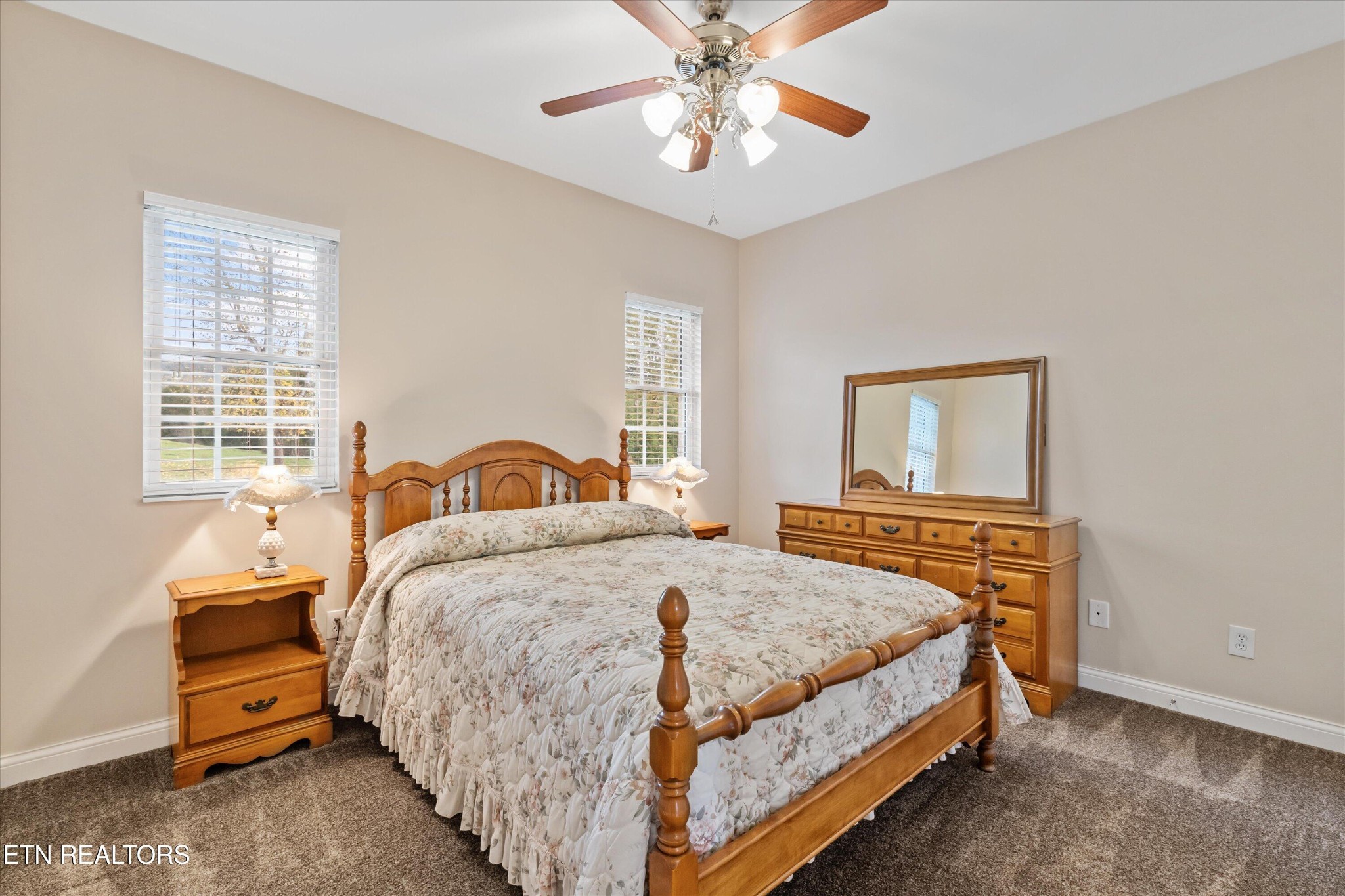 7613 Powderhorn Trail Townsend, TN 37882 - Photo 20 of 43 a bedroom with a bed and dresser with mirror