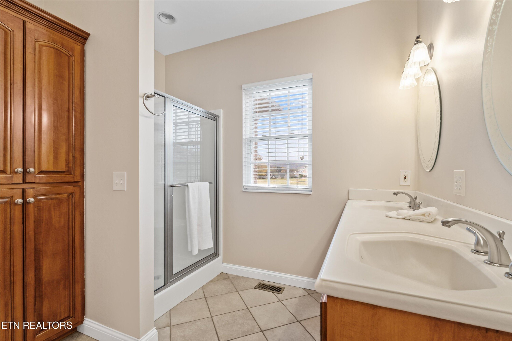 7613 Powderhorn Trail Townsend, TN 37882 - Photo 26 of 43 a bathroom with a sink a toilet and shower