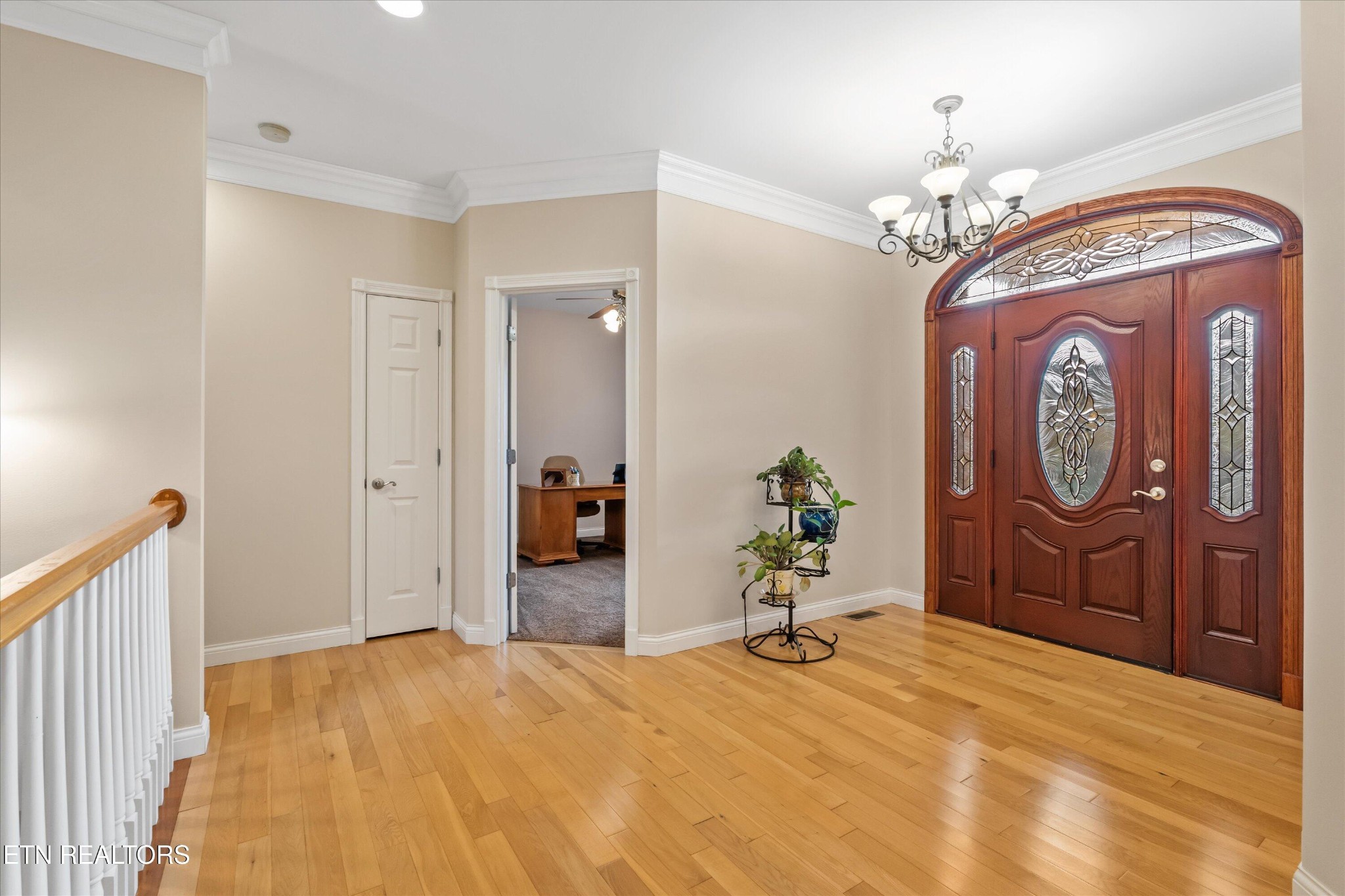 7613 Powderhorn Trail Townsend, TN 37882 - Photo 5 of 43 a bedroom with a bed and a chandelier
