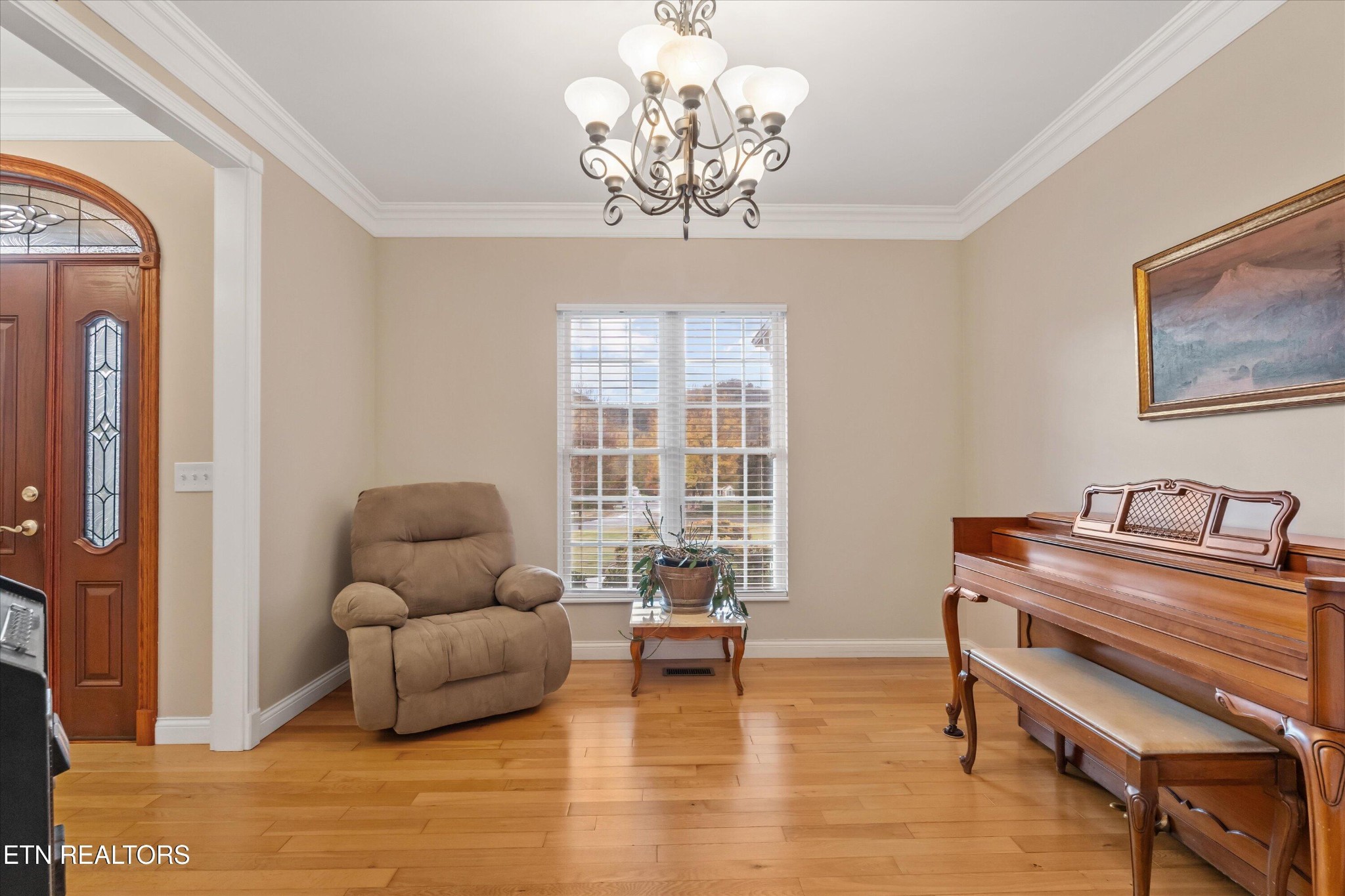 7613 Powderhorn Trail Townsend, TN 37882 - Photo 6 of 43 a living room with furniture and a chandelier