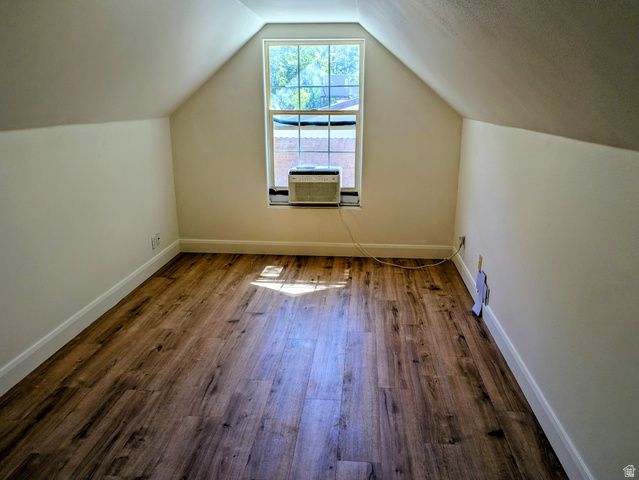 441 Main Street Hurricane, UT 84737 - Photo 10 of 29 Vaulted ceilings with exposed beams, wood-finish flooring, and a window unit
