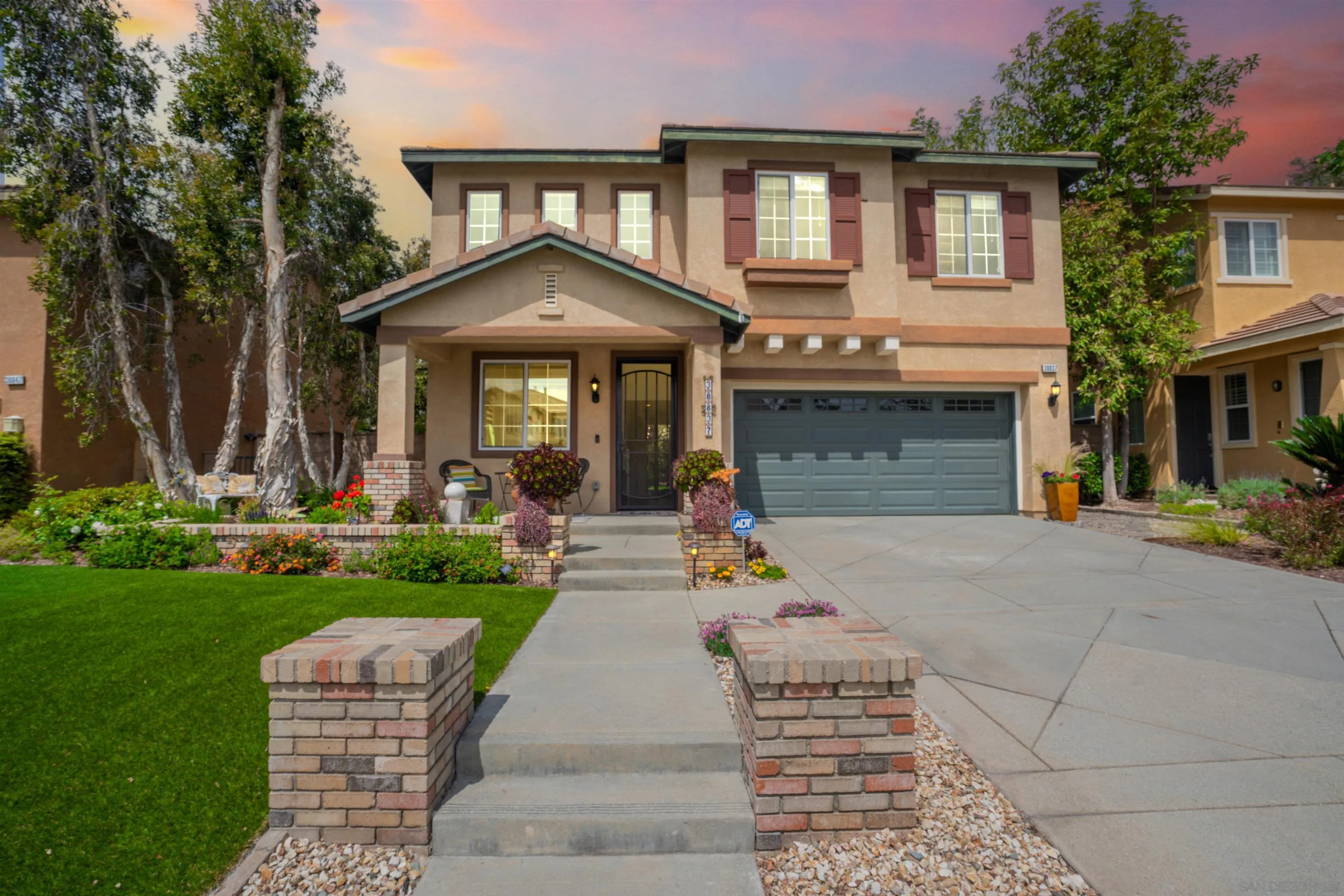 38837 Rockinghorse Road Murrieta, CA 92563 - Photo 1 of 41 a front view of a house with garden and trees