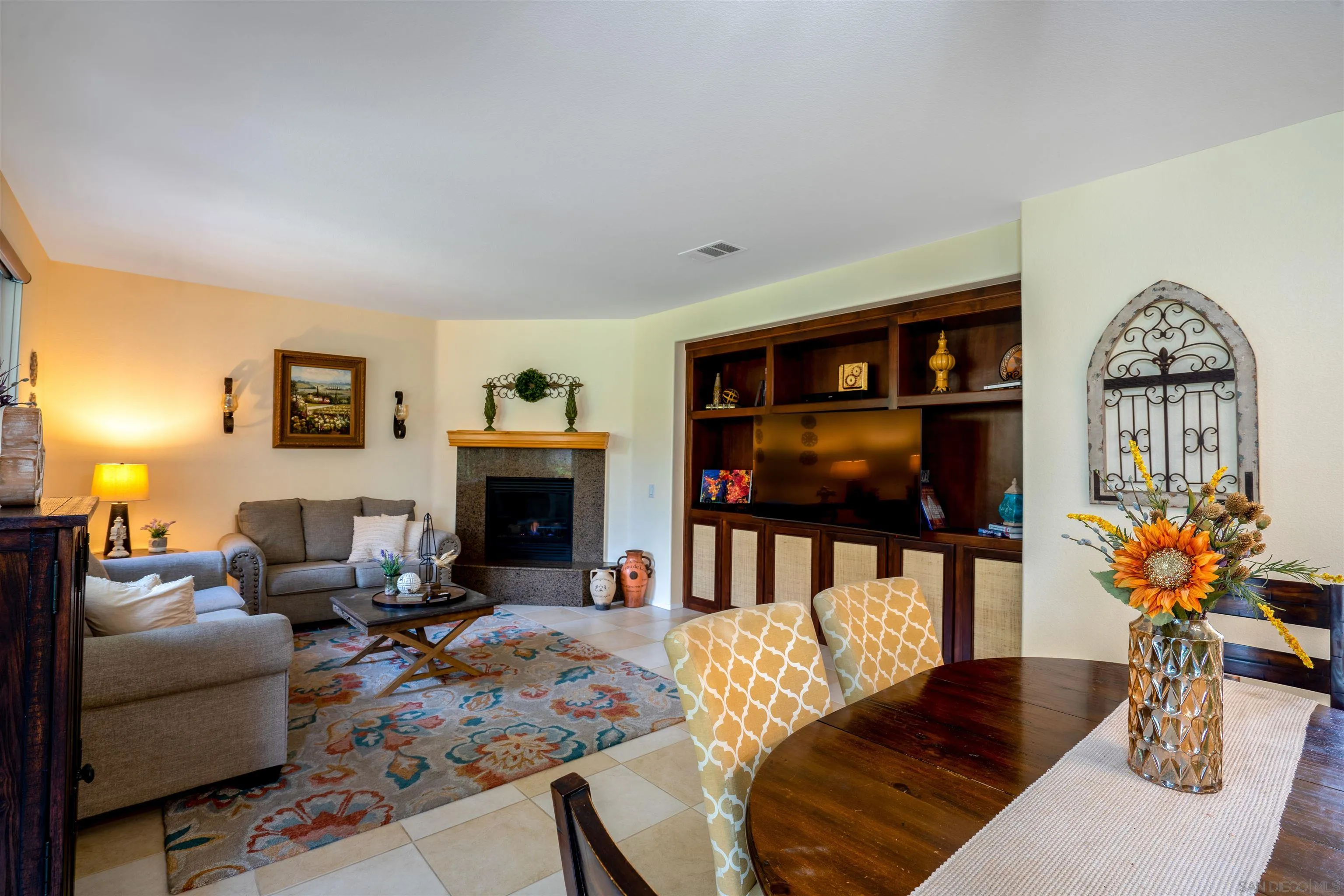 38837 Rockinghorse Road Murrieta, CA 92563 - Photo 15 of 41 a living room with furniture a fireplace and a flat screen tv