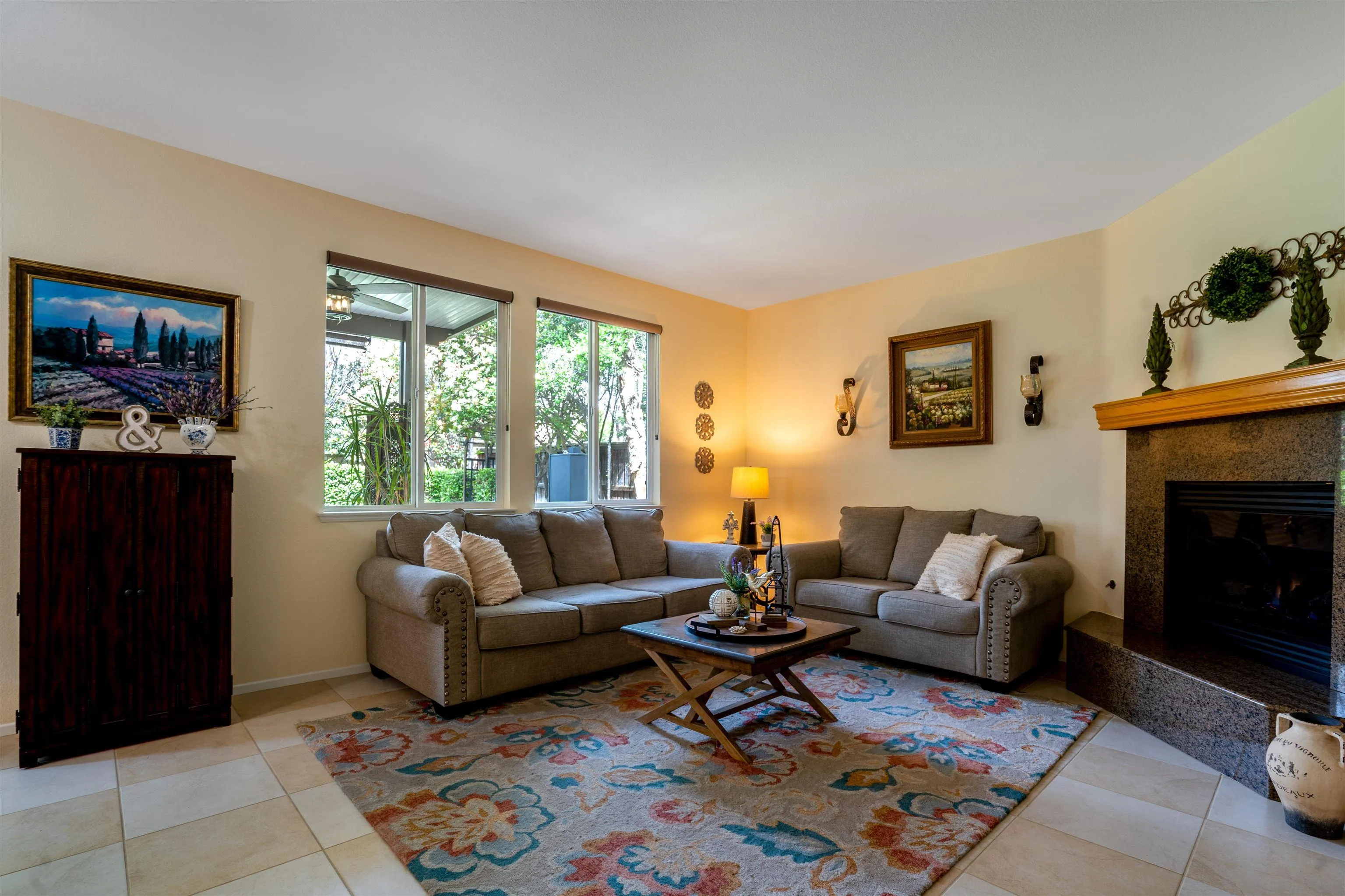 38837 Rockinghorse Road Murrieta, CA 92563 - Photo 17 of 41 a living room with furniture a rug and a fireplace