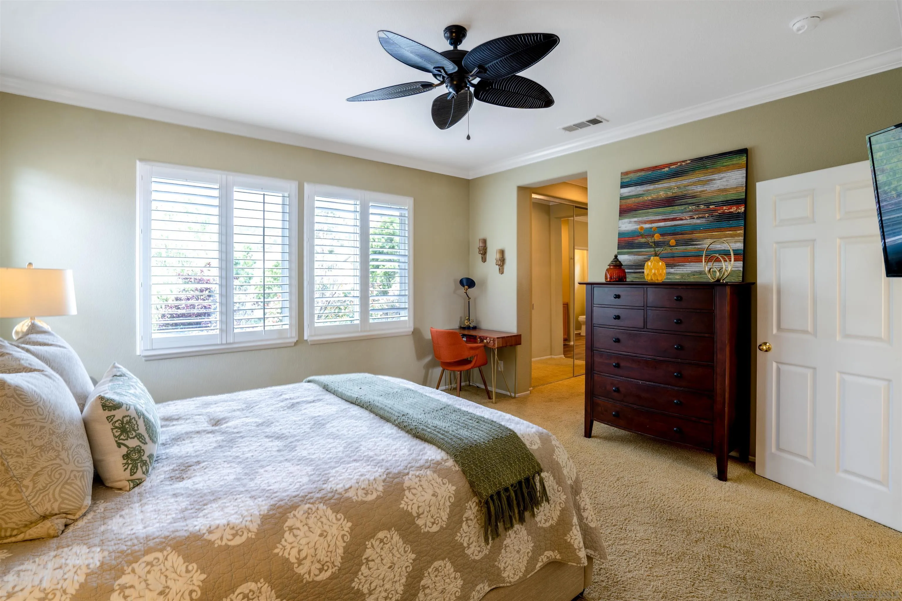 38837 Rockinghorse Road Murrieta, CA 92563 - Photo 23 of 41 a bedroom with a bed and a chandelier