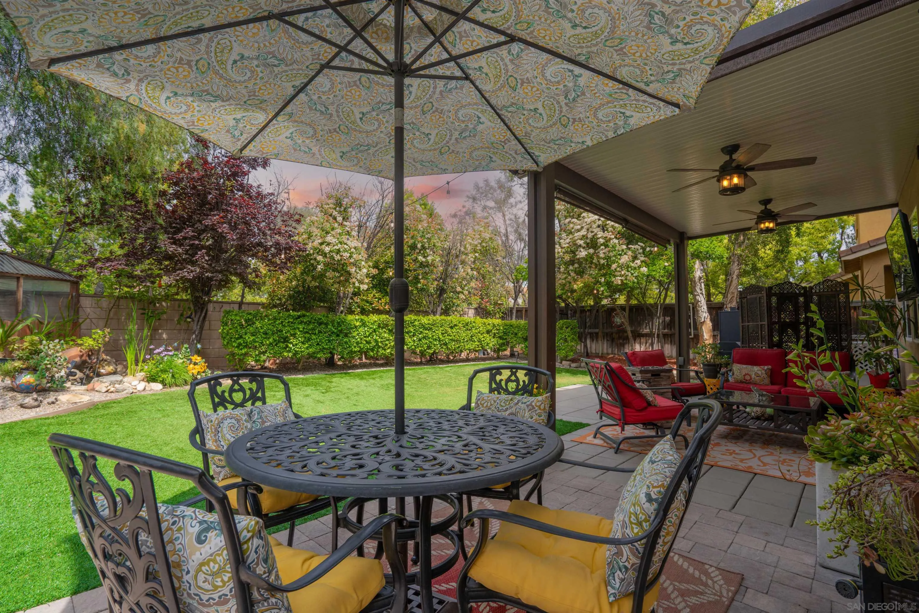 38837 Rockinghorse Road Murrieta, CA 92563 - Photo 32 of 41 a view of a patio with a table chairs and a umbrella