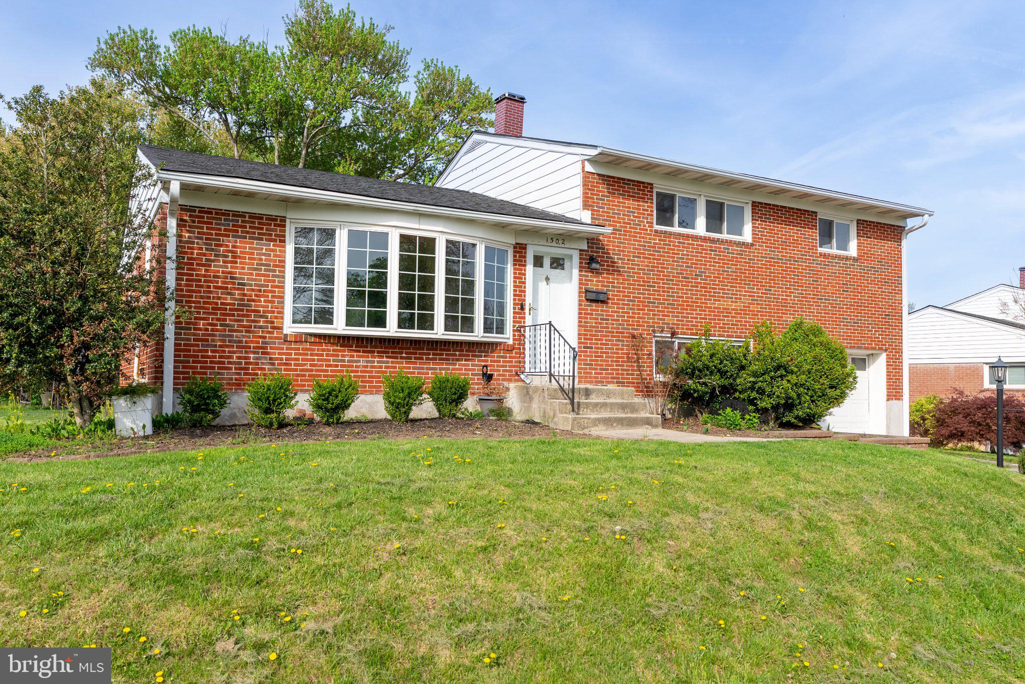 1502 Melton Road Lutherville-Timonium, MD 21093 - Photo 37 of 43 Charming brick home with lush greenery.