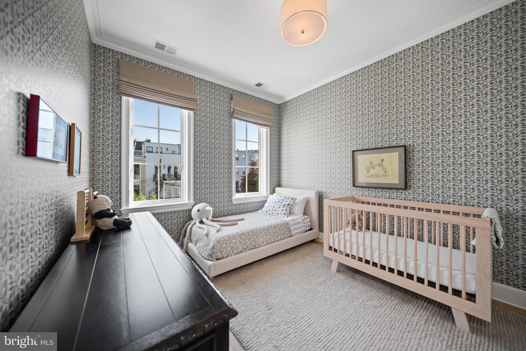 1304 S Street Northwest Washington, DC 20009 - Photo 13 of 23 a bed room with furniture and a window