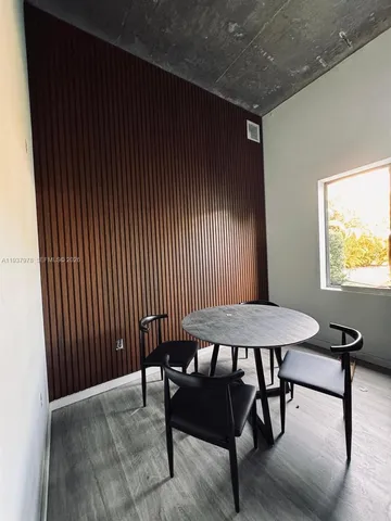 a view of a room with furniture window and wooden floor
