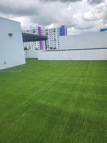 a view of backyard with trampoline