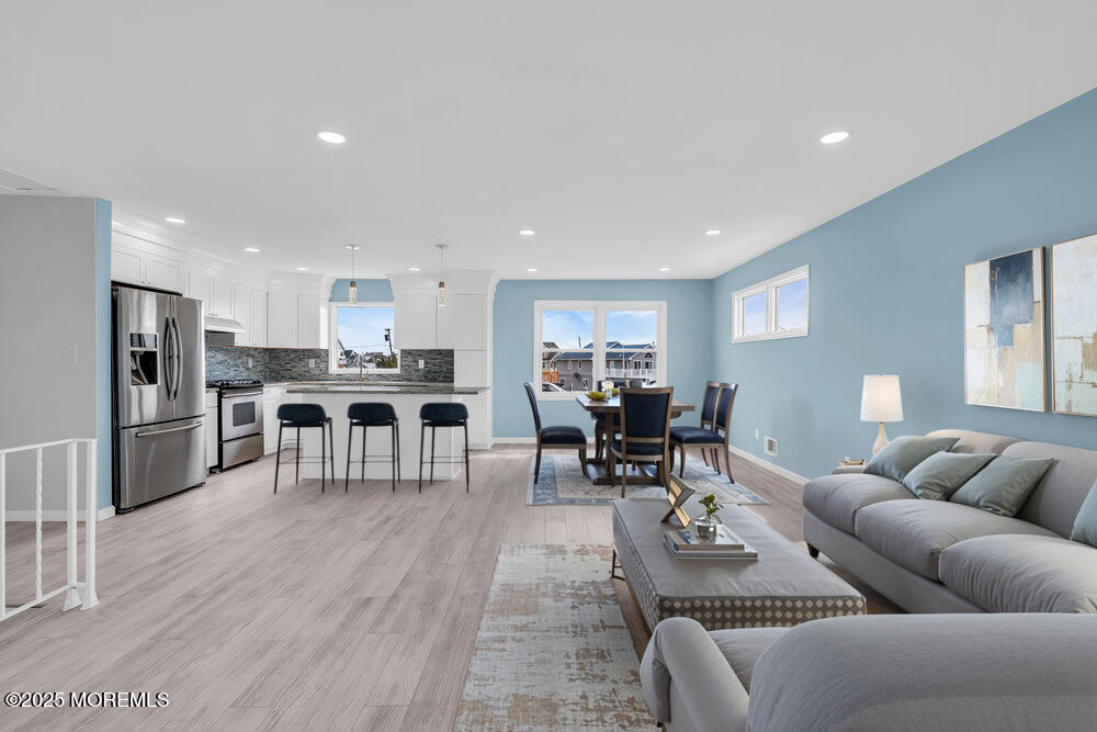 26 Mermaid Road Toms River, NJ 08753 - Photo 11 of 48 a living room with furniture kitchen view and a wooden floor