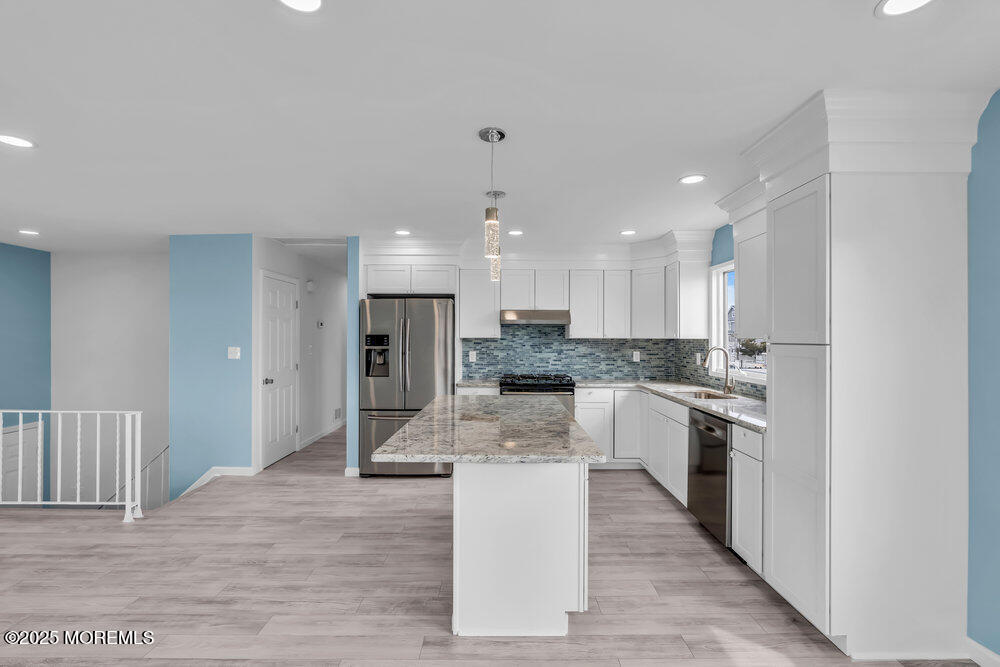 26 Mermaid Road Toms River, NJ 08753 - Photo 14 of 48 a large kitchen with kitchen island a sink stainless steel appliances and cabinets