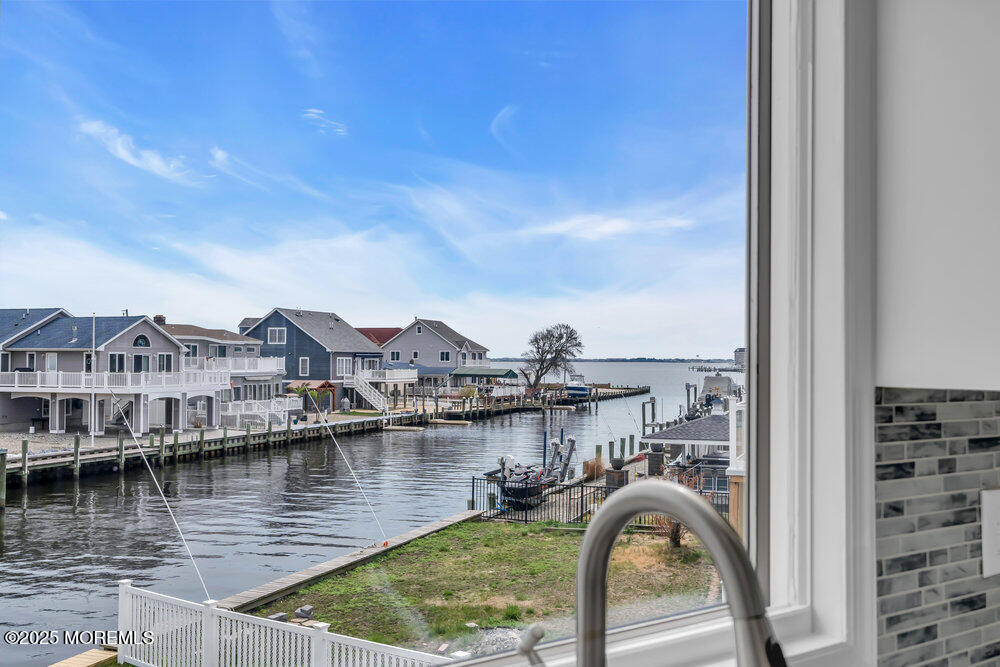26 Mermaid Road Toms River, NJ 08753 - Photo 17 of 48 a view of a lake with residential houses with outdoor space