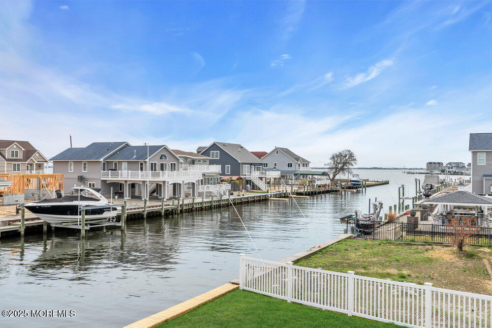 26 Mermaid Road Toms River, NJ 08753 - Photo 18 of 48 a view of a lake with houses
