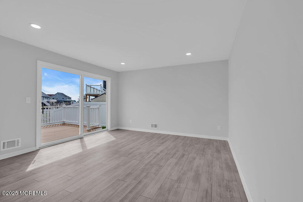 26 Mermaid Road Toms River, NJ 08753 - Photo 33 of 48 a view of empty room with wooden floor