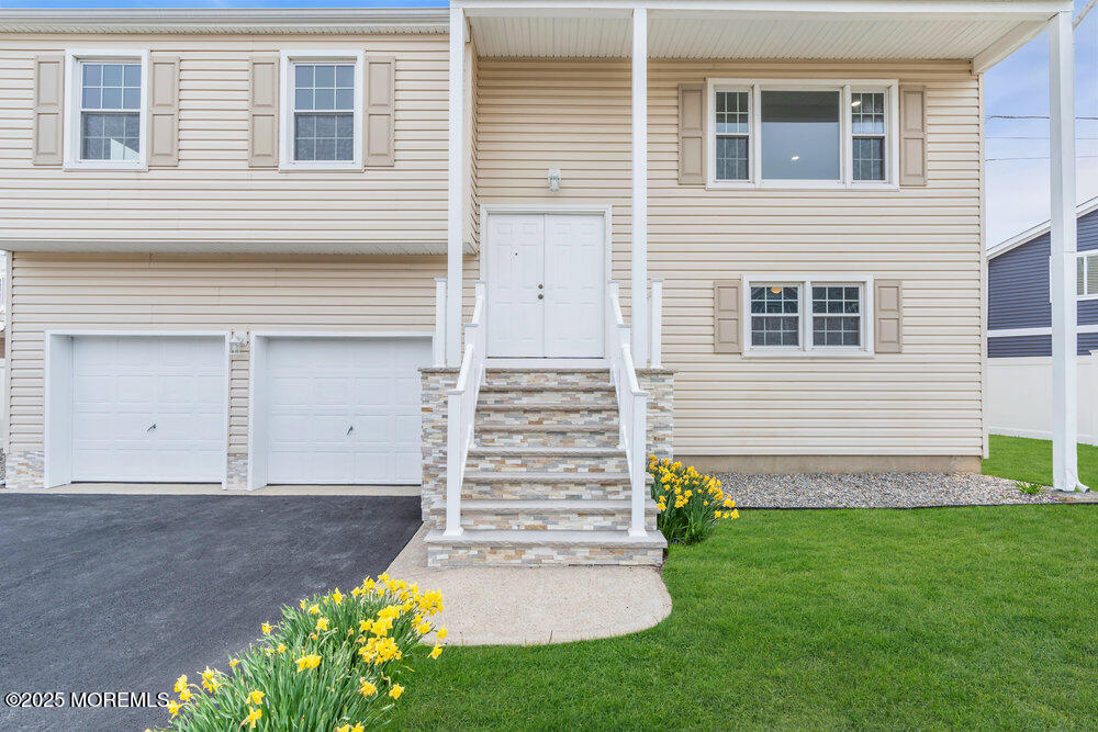 26 Mermaid Road Toms River, NJ 08753 - Photo 9 of 48 a front view of a house with garden