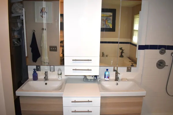 a bathroom with a bathtub and a sink