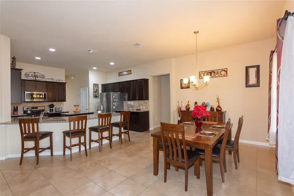 a view of a dining room with furniture