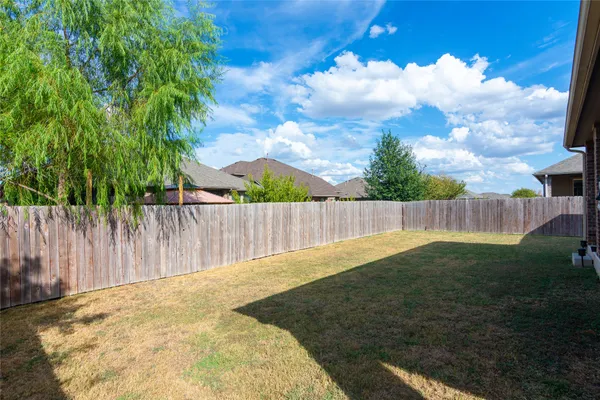 a swimming pool with wooden fence