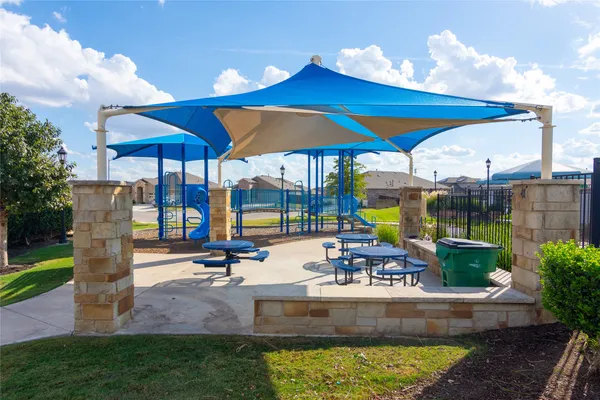 a view of a swimming pool with a patio