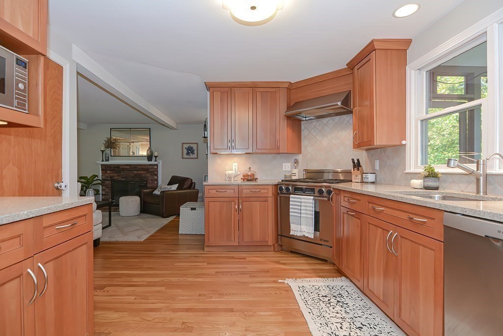 2 Meadowbrook Road Acton, MA 01720 - Photo 11 of 36 a kitchen with a refrigerator and a stove top oven