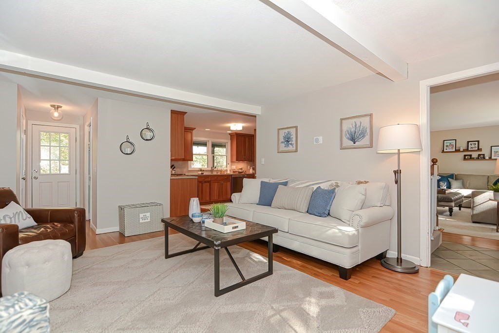2 Meadowbrook Road Acton, MA 01720 - Photo 12 of 36 a living room with furniture wooden floor and a lamp