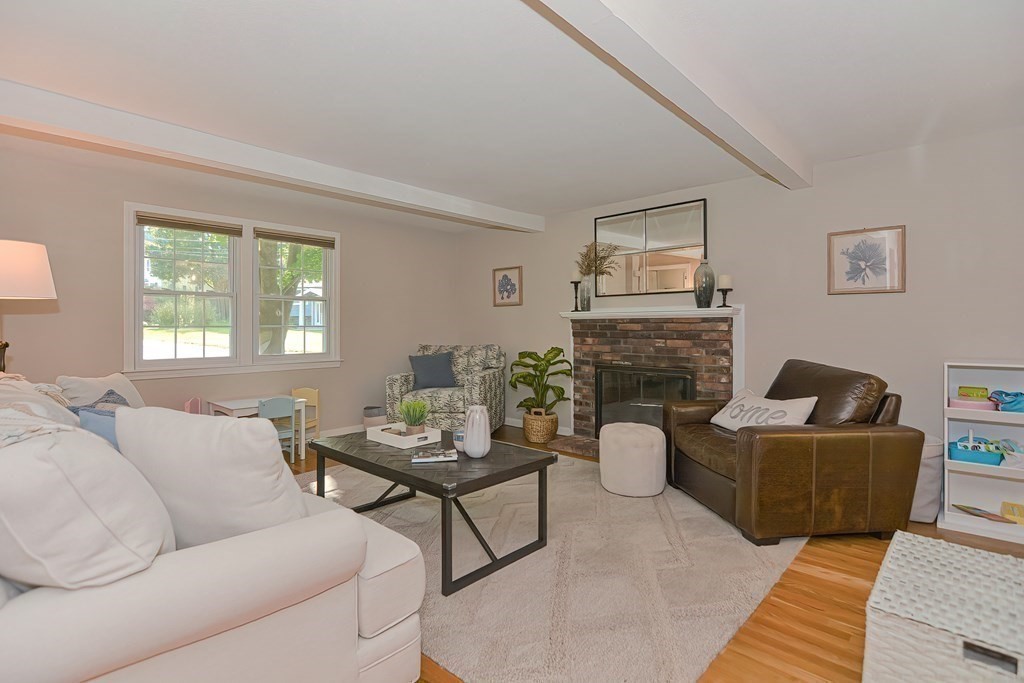 2 Meadowbrook Road Acton, MA 01720 - Photo 13 of 36 a living room with furniture and a fireplace