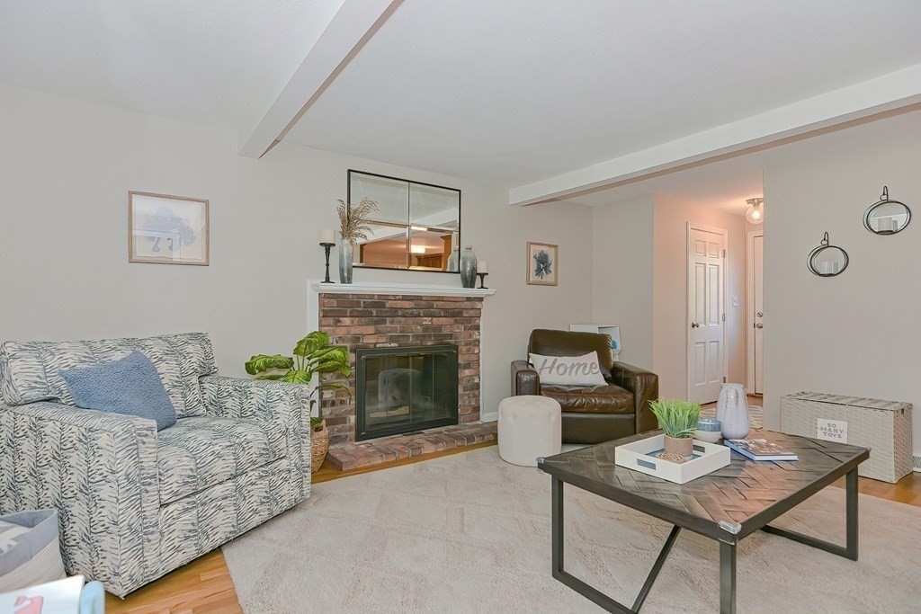 2 Meadowbrook Road Acton, MA 01720 - Photo 15 of 36 a living room with furniture and a fireplace